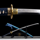 A Yonaguni Katana displayed on a black stand; features a blue scabbard, ornate gold tsuba, and detailed blade engraving, Yonaguni Katana.